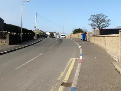 Painted kerbstones at Majors Hill, Annalong
