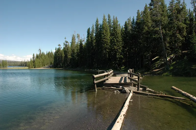 Broken wooden footbridge on the Yellowstone Lake shore, Grant Village Campground, Yellowstone National Park