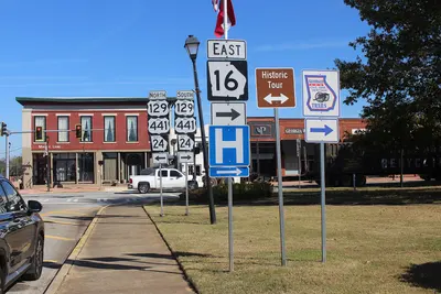 GA 16 East arrow road sign, hospital road sign, Eatonton Courthouse Square